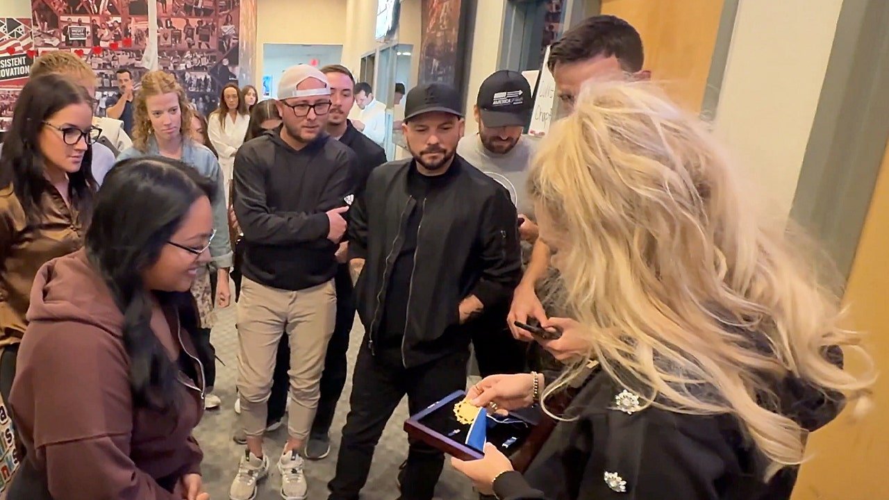 Erika Kirk shows Charlie Kirk’s Medal of Freedom to Turning Point staff